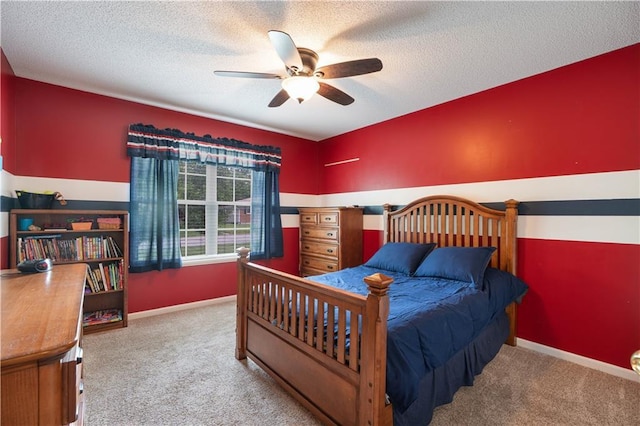 3100 Clarendon Rd, Sedalia, MO 65301 - carpeted bedroom featuring a textured ceiling, a ceiling fan, and baseboards