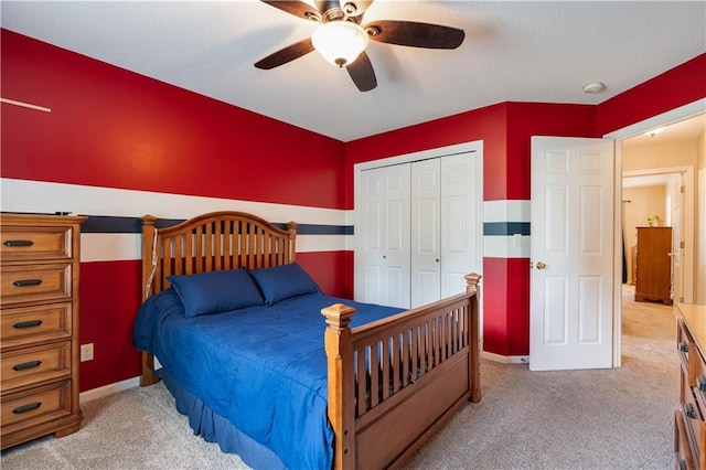 3100 Clarendon Rd, Sedalia, MO 65301 - bedroom featuring carpet, a closet, a ceiling fan, and baseboards