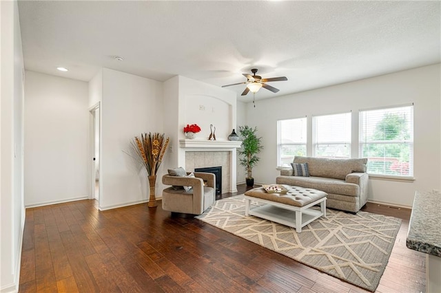 23713 W 88th St, Lenexa, KS 66227 - living room with hardwood / wood-style floors, ceiling fan, a tile fireplace, baseboards, and recessed lighting