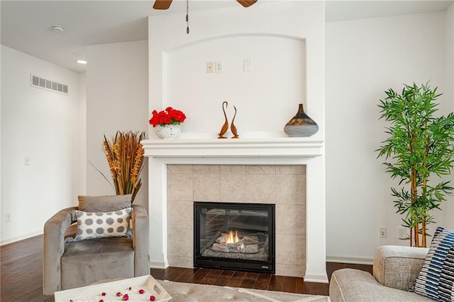 23713 W 88th St, Lenexa, KS 66227 - living area featuring a ceiling fan, wood finished floors, a tiled fireplace, baseboards, and recessed lighting
