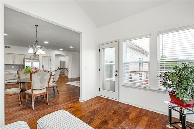 23713 W 88th St, Lenexa, KS 66227 - dining area with dark wood-type flooring, lofted ceiling, a chandelier, baseboards, and recessed lighting
