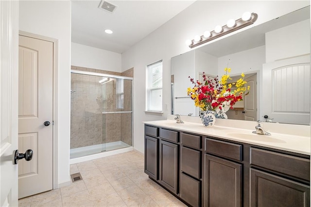 23713 W 88th St, Lenexa, KS 66227 - bathroom with double vanity, a stall shower, tile patterned floors, and recessed lighting