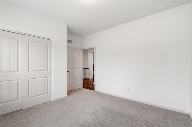 23713 W 88th St, Lenexa, KS 66227 - unfurnished bedroom with carpet floors, a closet, and baseboards