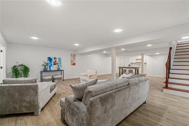 23713 W 88th St, Lenexa, KS 66227 - living room featuring stairway, light wood-type flooring, baseboards, and recessed lighting