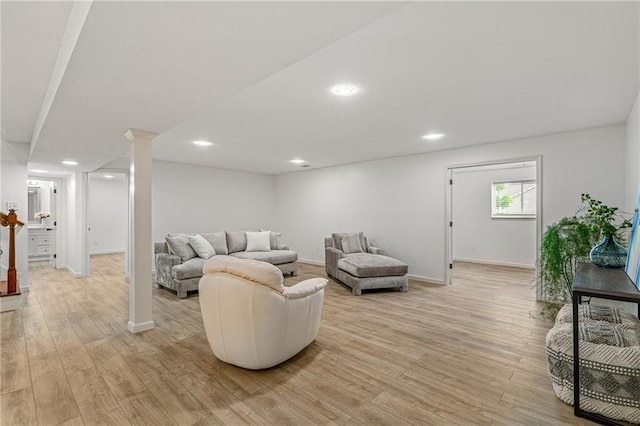 23713 W 88th St, Lenexa, KS 66227 - living room featuring light wood-type flooring, baseboards, recessed lighting, and ornate columns