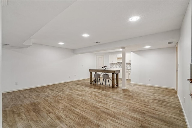 23713 W 88th St, Lenexa, KS 66227 - finished basement featuring light wood-style floors, recessed lighting, and baseboards