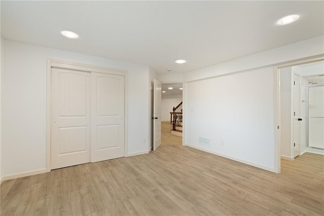 23713 W 88th St, Lenexa, KS 66227 - unfurnished bedroom with light wood-type flooring, recessed lighting, baseboards, and a closet