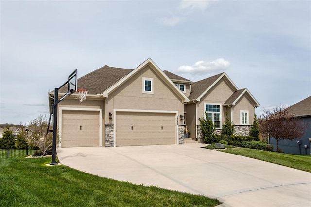 15670 W 165th Ter, Olathe, KS 66062 - view of front of property featuring stone siding, stucco siding, concrete driveway, and an attached garage
