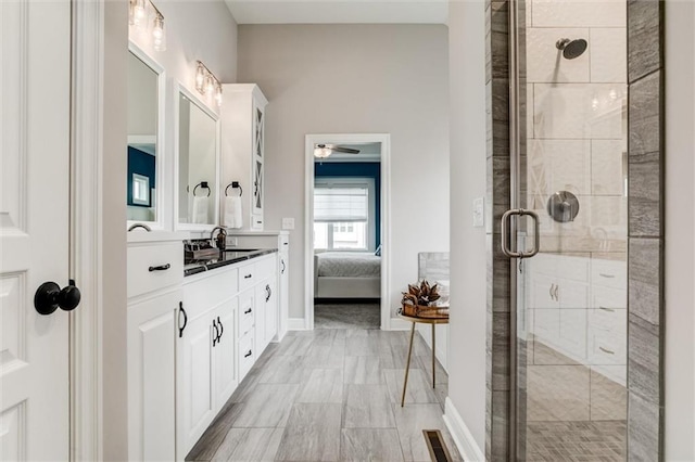 15670 W 165th Ter, Olathe, KS 66062 - ensuite bathroom with vanity, a shower stall, baseboards, and a ceiling fan