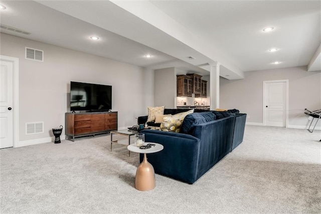 15670 W 165th Ter, Olathe, KS 66062 - living area featuring light colored carpet, baseboards, and recessed lighting