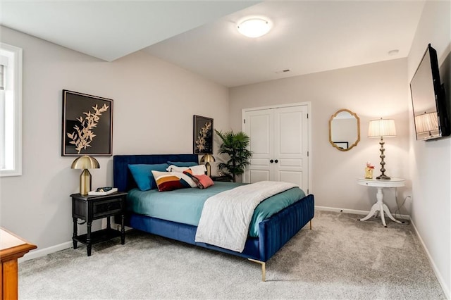 15670 W 165th Ter, Olathe, KS 66062 - bedroom with light colored carpet, a closet, and baseboards