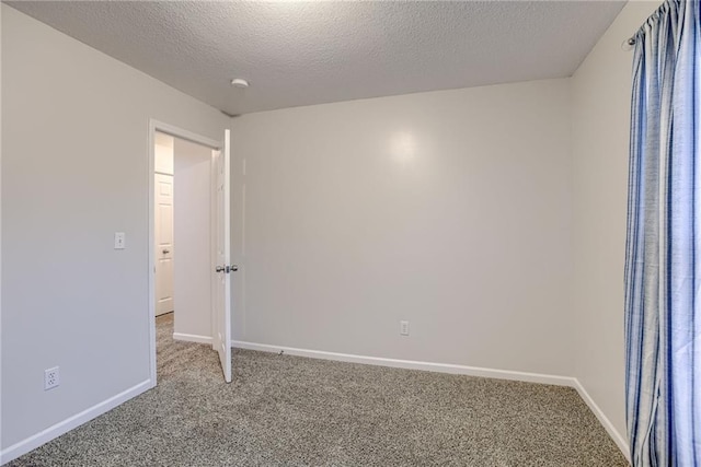 21830 S Race St, Spring Hill, KS 66083 - unfurnished room featuring carpet, baseboards, and a textured ceiling