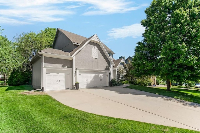 11304 W 144th St, Overland Park, KS 66221 - view of side of property featuring concrete driveway, a lawn, a garage, and stucco siding