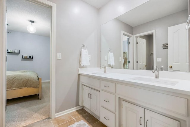 11304 W 144th St, Overland Park, KS 66221 - ensuite bathroom featuring double vanity, baseboards, and tile patterned flooring