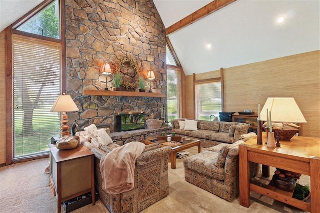 501 Taylor Rd, Independence, KS 67301 - living area featuring high vaulted ceiling, beamed ceiling, carpet, plenty of natural light, and a fireplace