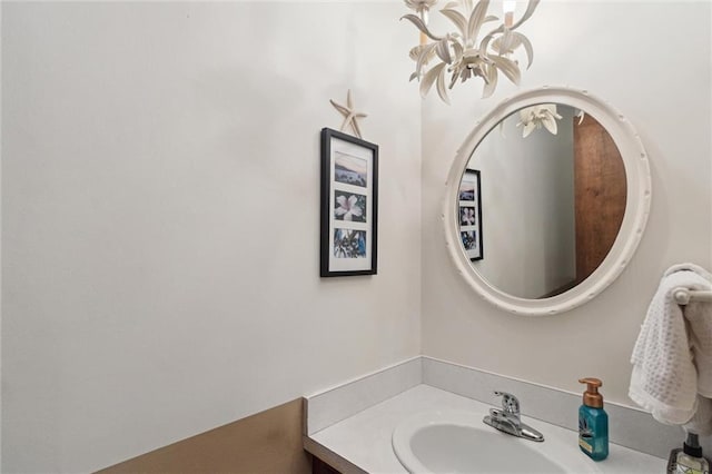 501 Taylor Rd, Independence, KS 67301 - bathroom with vanity and a chandelier