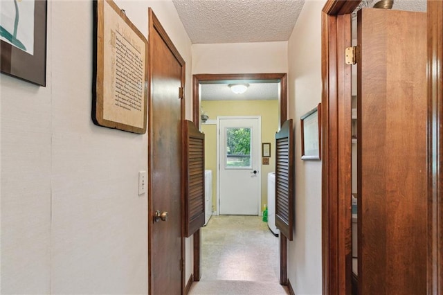 501 Taylor Rd, Independence, KS 67301 - corridor featuring a textured ceiling