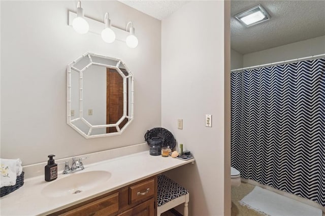 501 Taylor Rd, Independence, KS 67301 - full bath with a textured ceiling, vanity, and a shower with curtain
