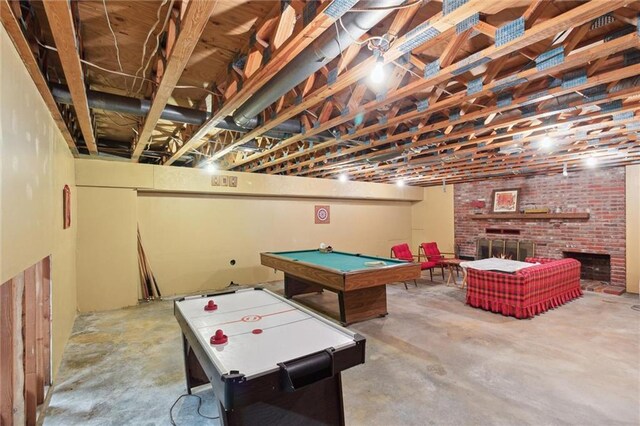 501 Taylor Rd, Independence, KS 67301 - recreation room with concrete floors, pool table, and a brick fireplace