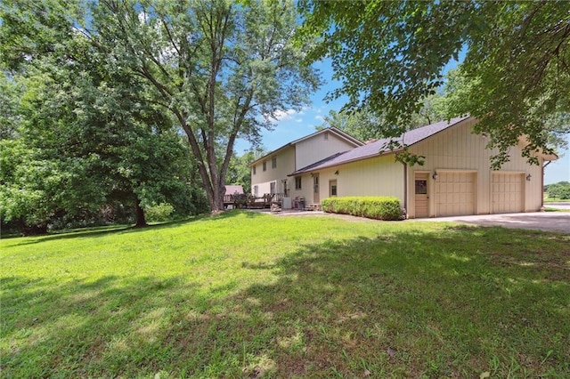 501 Taylor Rd, Independence, KS 67301 - view of green lawn with an attached garage and driveway