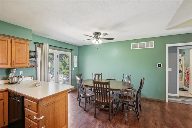 1022 N Davis Rd, Ottawa, KS 66067 - dining space featuring dark wood finished floors, a ceiling fan, and a textured ceiling