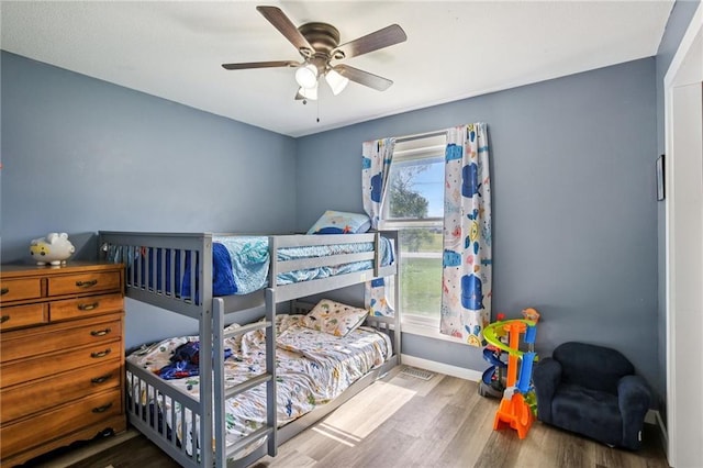 1022 N Davis Rd, Ottawa, KS 66067 - bedroom with wood finished floors and a ceiling fan
