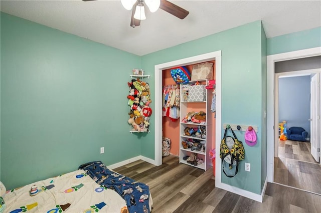 1022 N Davis Rd, Ottawa, KS 66067 - bedroom with wood finished floors and a ceiling fan
