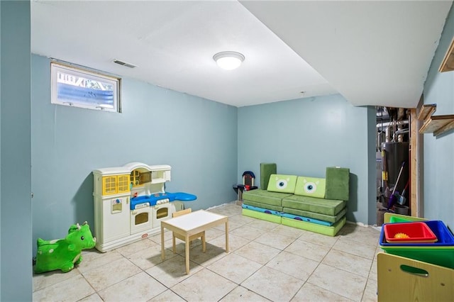 1022 N Davis Rd, Ottawa, KS 66067 - recreation room featuring tile patterned flooring and gas water heater