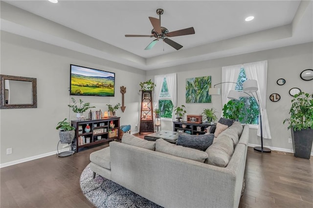 1302 N 159th St, Basehor, KS 66007 - living area with a ceiling fan, baseboards, dark wood-style flooring, a raised ceiling, and recessed lighting
