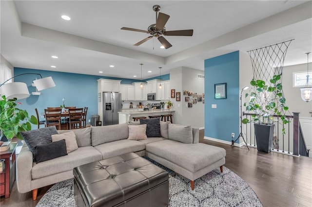 1302 N 159th St, Basehor, KS 66007 - living room with dark wood finished floors, ceiling fan, recessed lighting, and baseboards