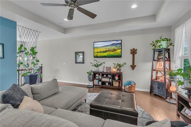 1302 N 159th St, Basehor, KS 66007 - living area with ceiling fan, baseboards, wood finished floors, recessed lighting, and a raised ceiling