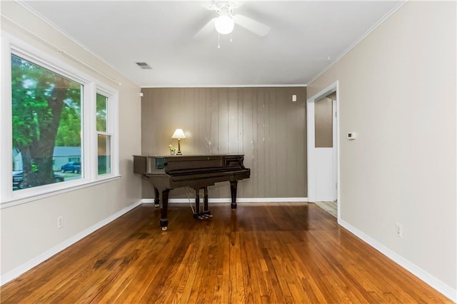 11424 W 67th Ter, Shawnee, KS 66203 - sitting room featuring wood finished floors, ceiling fan, baseboards, and crown molding