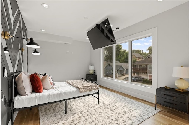 4550 Bell St, Kansas City, MO 64111 - bedroom with light wood-style floors and recessed lighting