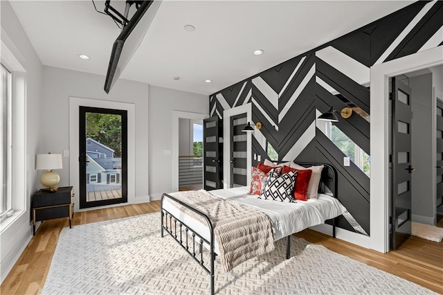 4550 Bell St, Kansas City, MO 64111 - bedroom featuring light wood-style floors, access to outside, and recessed lighting