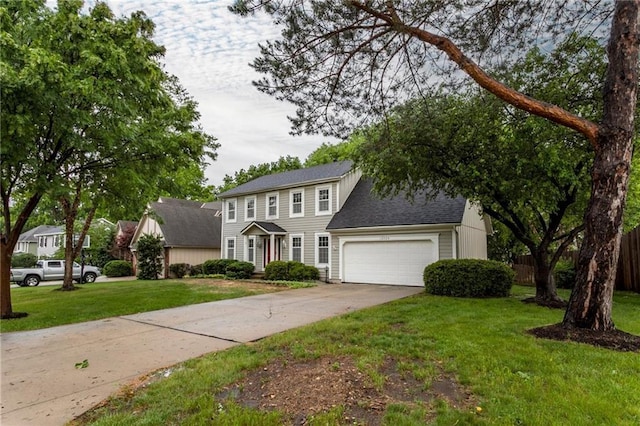 10404 Flint St, Overland Park, KS 66214 - colonial house featuring a garage, driveway, and a shingled roof