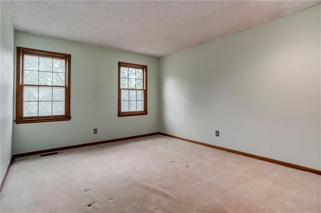 10404 Flint St, Overland Park, KS 66214 - unfurnished room featuring a textured ceiling, carpet floors, and baseboards