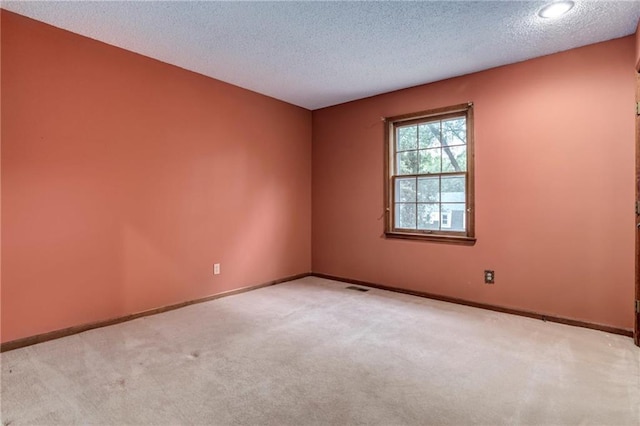 10404 Flint St, Overland Park, KS 66214 - unfurnished room with carpet flooring, a textured ceiling, and baseboards