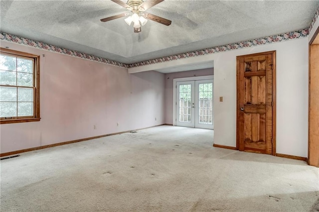 10404 Flint St, Overland Park, KS 66214 - empty room with carpet floors, a textured ceiling, baseboards, ceiling fan, and french doors