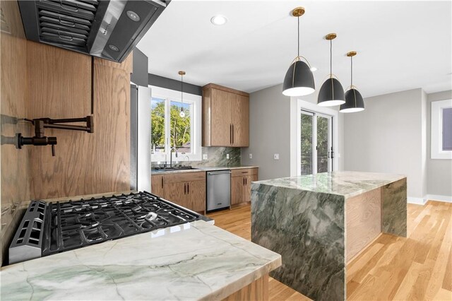 4544 Bell St, Kansas City, MO 64111 - kitchen with extractor fan, stainless steel dishwasher, brown cabinetry, light wood finished floors, and recessed lighting