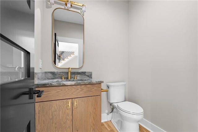 4544 Bell St, Kansas City, MO 64111 - bathroom with wood finished floors and vanity