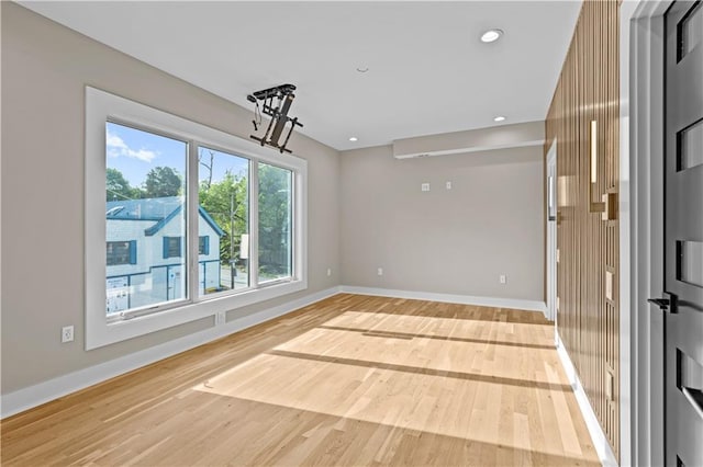 4544 Bell St, Kansas City, MO 64111 - empty room with light wood-style floors and recessed lighting