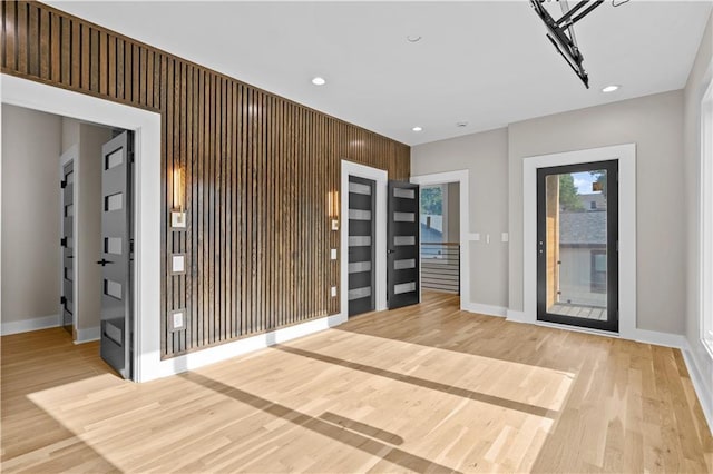 4544 Bell St, Kansas City, MO 64111 - entrance foyer with light wood-style flooring and recessed lighting