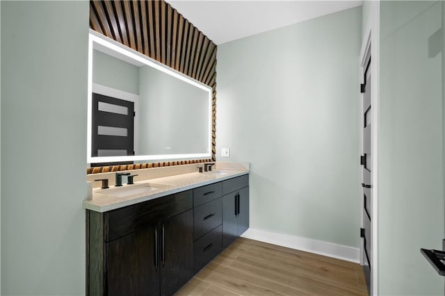 4544 Bell St, Kansas City, MO 64111 - bathroom with double vanity and wood finished floors