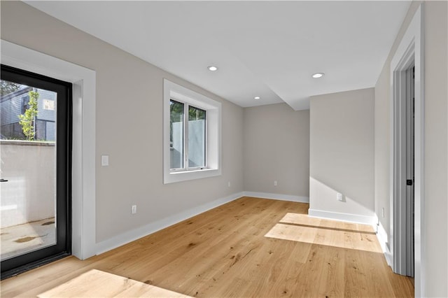 4544 Bell St, Kansas City, MO 64111 - empty room with wood finished floors and recessed lighting