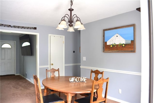 7141 SW F Hwy, Trimble, MO 64492 - dining space featuring a chandelier, carpet floors, and baseboards