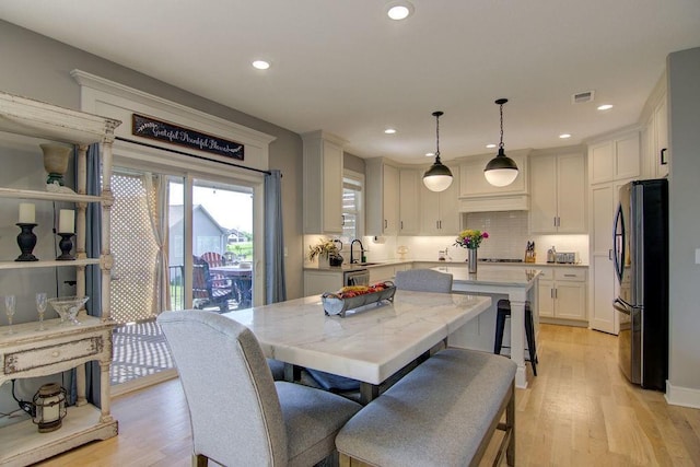 14485 S Houston St, Olathe, KS 66061 - dining space with light wood finished floors and recessed lighting