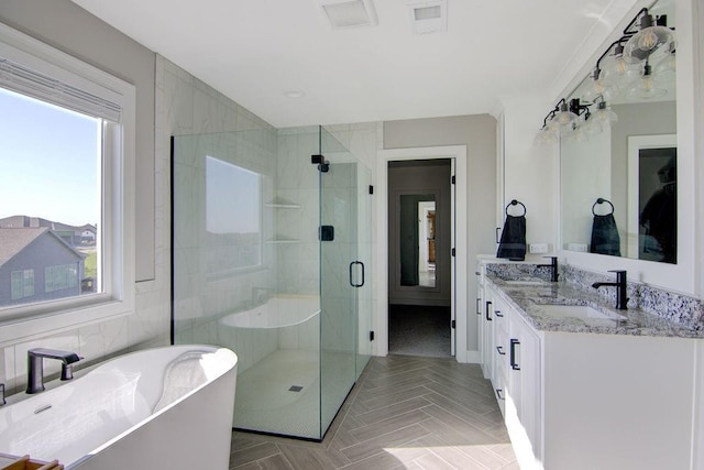14485 S Houston St, Olathe, KS 66061 - bathroom featuring a freestanding bath, a stall shower, and double vanity