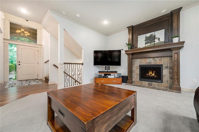 10601 N Euclid Ave, Kansas City, MO 64155 - living area with carpet floors, ornamental molding, a tiled fireplace, baseboards, and recessed lighting