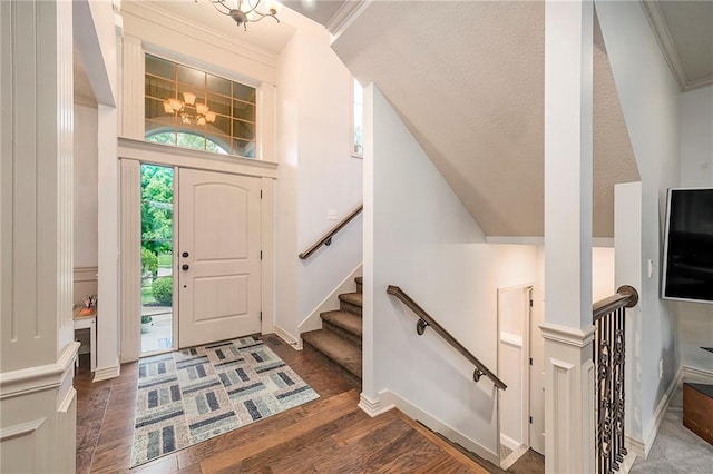 10601 N Euclid Ave, Kansas City, MO 64155 - foyer featuring dark wood finished floors, a chandelier, baseboards, and ornamental molding