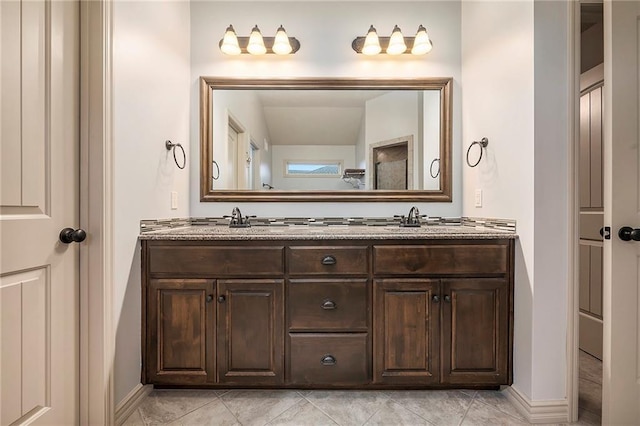10601 N Euclid Ave, Kansas City, MO 64155 - bathroom with double vanity, baseboards, and tile patterned flooring